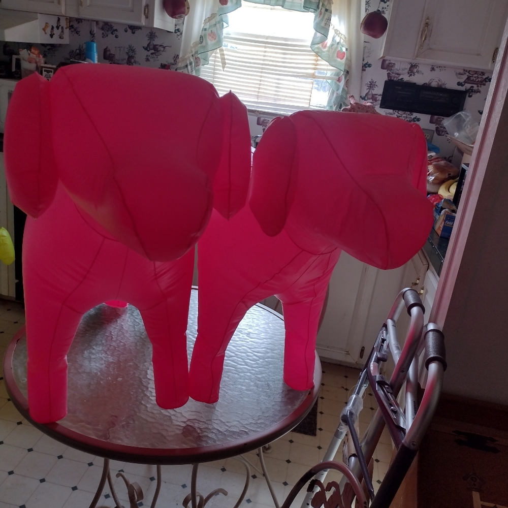 2 Giant pink blow up dogs one has hole and patch has slow leak breaks my 💔😭